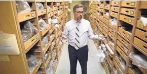  ?? MILWAUKEE JOURNAL SENTINEL MIKE DE SISTI / ?? Milwaukee Public Museum President and CEO Dennis Kois discusses inadequate storage conditions in the building’s damp basement in 2015.