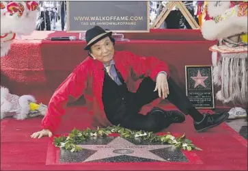  ?? Mark J. Terrill Associated Press ?? SURROUNDED by music and lion dancers, James Hong enjoys his brand-new star on Hollywood Boulevard.