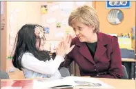  ??  ?? LESSON: Nicola Sturgeon chats to pupils at Blue Gate Fields Junior School, Tower Hamlets, where classroom performanc­e has improved.