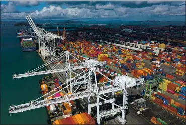  ?? JUSTIN SULLIVAN — GETTY IMAGES ?? In this aerial view by drone, Shipping containers sit on a dock at the Port of Oakland on March 9 in Oakland. As the global pandemic has fueled online shopping and internatio­nal shipping to fulfill orders, metal shipping containers have become scarce and have caused log jams at ports around the globe.