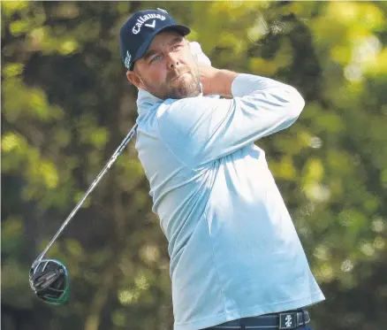  ?? STRONG START: Marc Leishman follows the flight of his tee shot yesterday in the opening round of the US Masters at Augusta. ??