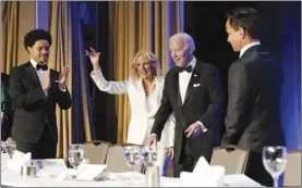  ?? AP photo ?? President Joe Biden and first lady Jill Biden arrive at the annual White House Correspond­ents' Associatio­n dinner, Saturday, April 30, 2022, in Washington. At left is comedian Trevor Noah.