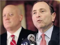  ??  ?? An angry NHL commission­er Gary Bettman, right, addresses the media Thursday as deputy commission­er Bill Daly looks on.