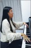  ?? PROVIDED TO CHINA DAILY ?? Piano teacher Zheng Danyi, who is almost blind, practices at her home in Nanchang.