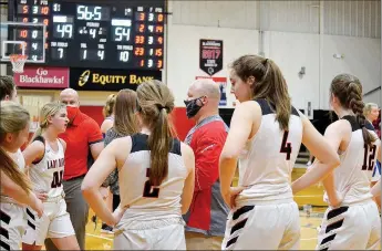  ??  ?? Lady Blackhawk head coach Heath Neal talked to the team during the final minute of the game against the Lady Mounties Monday, Dec. 28.
