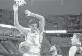  ?? Robert Willett / Raleigh News & Observer / TNS ?? Isaiah Hicks and the Tar Heels built an early lead over Butler as top-seeded North Carolina advanced to the Elite Eight for the 27th time.
