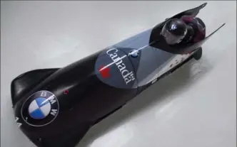  ?? JONATHAN HAYWARD, THE CANADIAN PRESS ?? Chris Spring and Lascelles Brown of Canada race during the first run of 2-man bobsled at the IBSF World Cup in Whistler, B.C., in 2016. Spring has sold most of what he owns to simplify his life and focus on his sport.