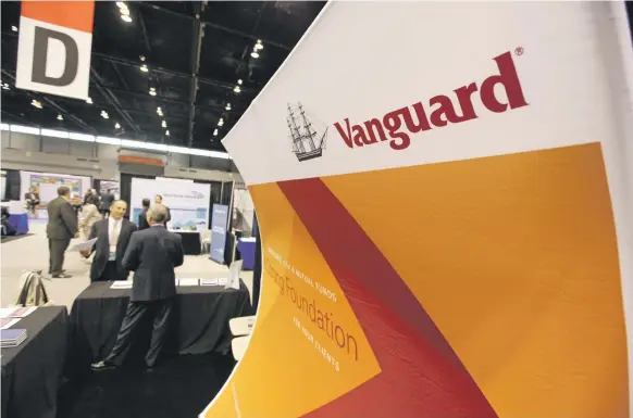  ?? AP ?? Vanguard Group cut its fees again on October 23, this time announcing that it would reduce the cost of 13 London-listed ETFs