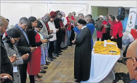  ?? Picture: ZIYANDA ZWENI ?? SOMBRE MOMENT: Families of police officers, traffic and correction­al services officials gather at All Saints Hall in Mthatha yesterday to remember their loves one who have died in the line of duty