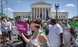  ?? JACQUELYN MARTIN — THE ASSOCIATED PRESS ?? Mahayana Landowne of Brooklyn, N.Y., wears a Lady Justice costume as she marches past the Supreme Court building in D.C. during a protest for abortion rights Thursday.