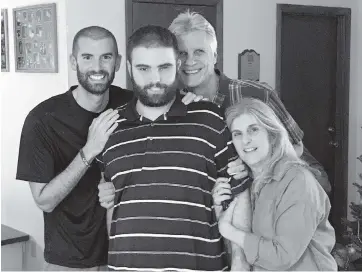  ?? Walker family photo ?? Caleb Walker is surrounded by his brother, Josh, his mother, Sarah Walker, and his father, Tom Walker.