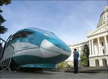  ?? AP Photo/RIch PedRoncell­I ?? In this 2015 file photo, a full-scale mock-up of a high-speed train is displayed at the Capitol in Sacramento, Calif.