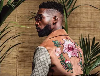  ??  ?? Top Tinie Tempah presenting his own menswear line, What We Wear, at LC:M SS’ 18 Right Wearing a Gucci trench coat while promoting his latest album, Youth