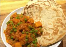  ?? Emily Larsen ?? Chef Emily Larsen’s curry and naan will be featured on her online class. The class on “Adaptable Dishes” will include stir-fries, curries and ramens that can easily be modified for whatever proteins and vegetables you have on hand.