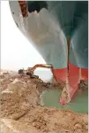  ?? SUEZ CANAL AUTHORITY VIA AP ?? A backhoe on Thursday tries to dig out the keel of the Ever Given, a Panama-flagged cargo ship, that is wedged across the Suez Canal and blocking traffic in the vital waterway.