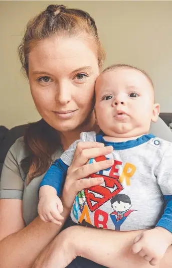  ?? UPSETTING: Townsville mum Jessie Taylor with 11- week- old son Riley. Picture: ZAK SIMMONDS ??