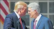  ?? AP ?? US President Donald Trump congratula­tes Neil Gorsuch who was sworn in as an associate justice of the Supreme Court.