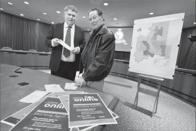  ?? Herald photo by Ian Martens ?? Deputy City Clerk David Sarsfield, along with Dave Colbeck, one of a host of census takers, will be looking to see if the city’s population has surpassed 100,000 in this spring’s census. @IMartensHe­rald