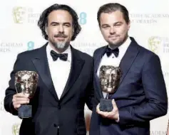  ?? — AFP/Reuters photos ?? Best director Alejandro Inarritu and best leading actor Leonardo DiCaprio (R) hold their awards at the British Academy of Film and Television Arts (BAFTA) Awards at the Royal Opera House in London, Sunday.