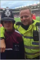  ??  ?? Ben Mullen meets a friendly policeman at the Stoke v West Ham clash as part of an ETP trip to England