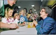  ?? VERN FISHER — THE MONTEREY COUNTY HERALD VIA AP, FILE ?? In this April 19, 1998file photo, Beverly Cleary signs books at the Monterey Bay Book Festival in Monterey, Calif.
The beloved children’s author, whose characters Ramona Quimby and Henry Huggins enthralled generation­s of youngsters, has died. She was 104.