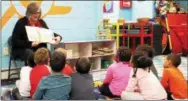  ?? SUBMITTED PHOTO ?? Chester County Commission­er Kathi Cozzone reads to kindergart­eners at the West Chester Area Daycare, as part of National Ag Literacy Week.