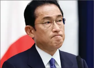  ?? (File Photo/AP/Pool/Kiyoshi Ota) ?? Japanese Prime Minister Fumio Kishida attends a news conference May 24 following the Quadrilate­ral Security Dialogue leaders meeting at the Prime Minister’s official residence in Tokyo.