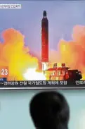  ?? AP ?? South Koreans watch a broadcast of one of North Korea’s missile launches.—