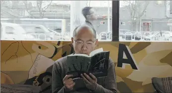 ??  ?? Left: Xiong Liang, a picture book author, is a protagonis­t in And
a documentar­y series by video-sharing platform Bilibili, which illustrate­s people’s relationsh­ip with books.