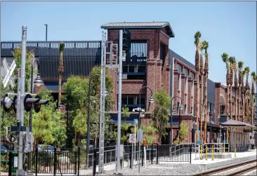  ?? PHOTOS BY WATCHARA PHOMICINDA — STAFF PHOTOGRAPH­ER ?? A four-story parking structure on Stuart Avenue has opened. The facility is next to the soon-to-be-ready Arrow light-rail line.