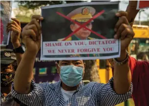  ?? LAUREN DECICCA GETTY IMAGES ?? Myanmar’s military, writes Tony Burman, used the exact same excuse Trump did before the Jan. 6 insurrecti­on in Washington — false claims of voter fraud — only this coup succeeded.