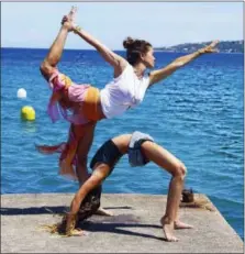  ?? BROOKE BURKE CHARVET VIA AP ?? This undated photo provided by Brooke Burke-Charvet shows Charvet doing yoga with her daughter Rain in Malibu