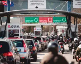  ??  ?? Vehicles line up at the border of the British Colony of Gibraltar in La Linea de la Concepcion on April 7. Gibraltar accused Spain of causing traffic jams with tightened border controls. Gibraltar has emerged as a sore point in Britain’s exit...