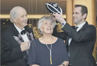  ?? PICTURES: JON SAVAGE; SRU; GETTY IMAGES ?? 0 Clockwise from top, Patricia Russell receives the cap from Alexander Mccall Smith and Chris Paterson at the fundraisin­g gala; Liddell in his Scotland rugby kit; the athlete is paraded around Edinburgh University after returning from Paris with an...