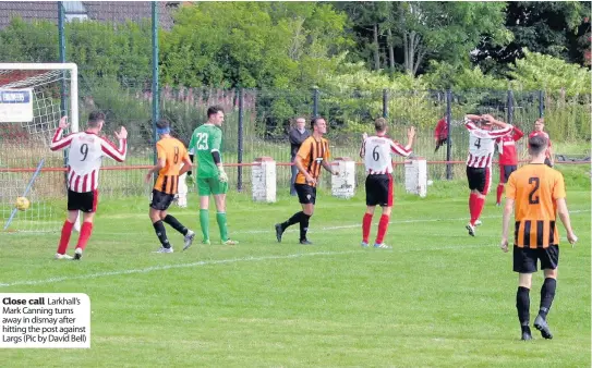  ??  ?? Close call Larkhall’s Mark Canning turns away in dismay after hitting the post against Largs (Pic by David Bell)