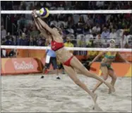  ?? MARCIO JOSE SANCHEZ — THE ASSOCIATED PRESS FILE ?? In this file photo, United States’ Kerri Walsh Jennings reaches for a ball against Australia during a women’s beach volleyball quarterfin­al match at the 2016 Summer Olympics. Beach volleyball has a new ally as it tries to grow from an Olympic...