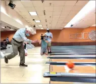  ?? GLENN GRIFFITH — MEDIANEWS GROUP ?? Joe Gentiluomo, 98, the inventor of the modern bowling ball, hits the lanes at Spare Time Clifton Park after it reopened last week