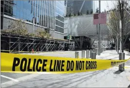  ?? Eric Risberg ?? The Associated Press Police tape blocks off Fremont Street on Wednesday outside the closed Salesforce Transit Center in San Francisco.