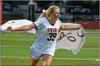  ?? THOMAS NASH - MERCURY FILE ?? Hannah Delahaye runs around the field sporting Owen J. Roberts’ four-peat sign as a cape following the Wildcats’ PAC Championsh­ip win over Boyertown in 2018.