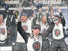  ?? [JOHN BAZEMORE/THE ASSOCIATED PRESS] ?? Kevin Harvick celebrates after winning Sunday’s NASCAR Monster Cup Series race at Atlanta Motor Speedway.