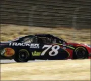  ?? ALVIN JORNADA — THE PRESS DEMOCRAT VIA AP ?? Martin Truex Jr. speeds toward Turn 3 during practice for the NASCAR Cup Series auto race at Sonoma Raceway in Sonoma Friday. Truex remains dependable in qualifying with 11 starts in the top 10 this year.