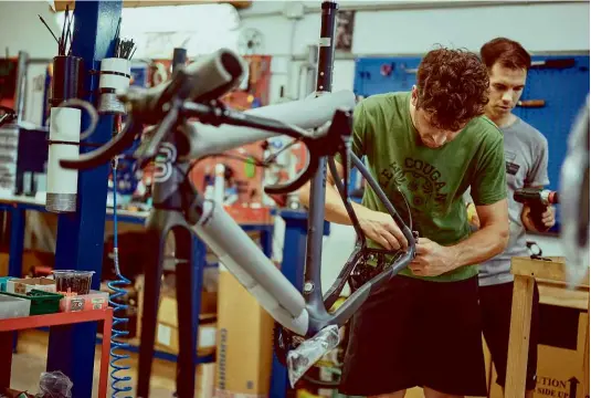  ??  ?? Below: Basso assembles bikes at its headquarte­rs in Vicenza, while carbon frames are made at a nearby factory in which Basso has shares