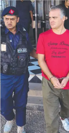  ?? Picture: GARY RAMAGE ?? John Nikolic was taken to the Magistrate­s Court in Nadi after raids on his boat.