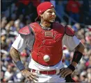  ?? JEFF ROBERSON / ASSOCIATED PRESS ?? A ball stuck on Cardinals catcher Yadier Molina’s chest protector set the stage for the Cubs’ comeback victory Thursday.