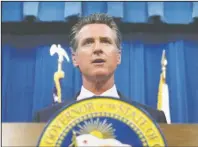  ?? The Associated Press ?? NEW LAW: California Gov. Gavin Newsom speaking during a news conference on July 23, in Sacramento, Calif. Newsom signed a law Tuesday, requiring presidenti­al candidates to release their tax returns to appear on the state's primary ballot, a move aimed squarely at Republican President Donald Trump.