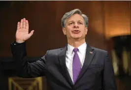  ?? ALEX WONG / GETTY IMAGES ?? Christophe­r Wray, the nominee for FBI director, is sworn in at his confirmati­on hearing Wednesday before the Senate Judiciary Committee in Washington.