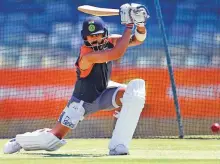  ?? AFP ?? Indian captain Virat Kohli drives a ball at the nets ahead of the second Test against Australia in Perth.