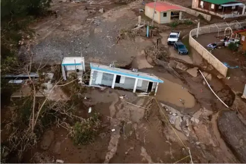  ?? ?? A house l ies in the mud after being washed away by Hurricane Fiona in Puerto Rico (AP)