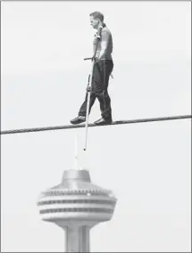  ?? David Duprey, Associated Press ?? Nik Wallenda, 33, performs a tightrope walk during a training session in Niagara Falls, N.Y., last month. He will walk across the Falls Friday night.