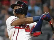  ?? JOHN BAZEMORE / AP 2018 ?? Atlanta Braves left fielder Ronald Acuna Jr. helped the Atlanta Braves accelerate their rebuilding schedule in 2018, when they were the surprise winners of the NL East.